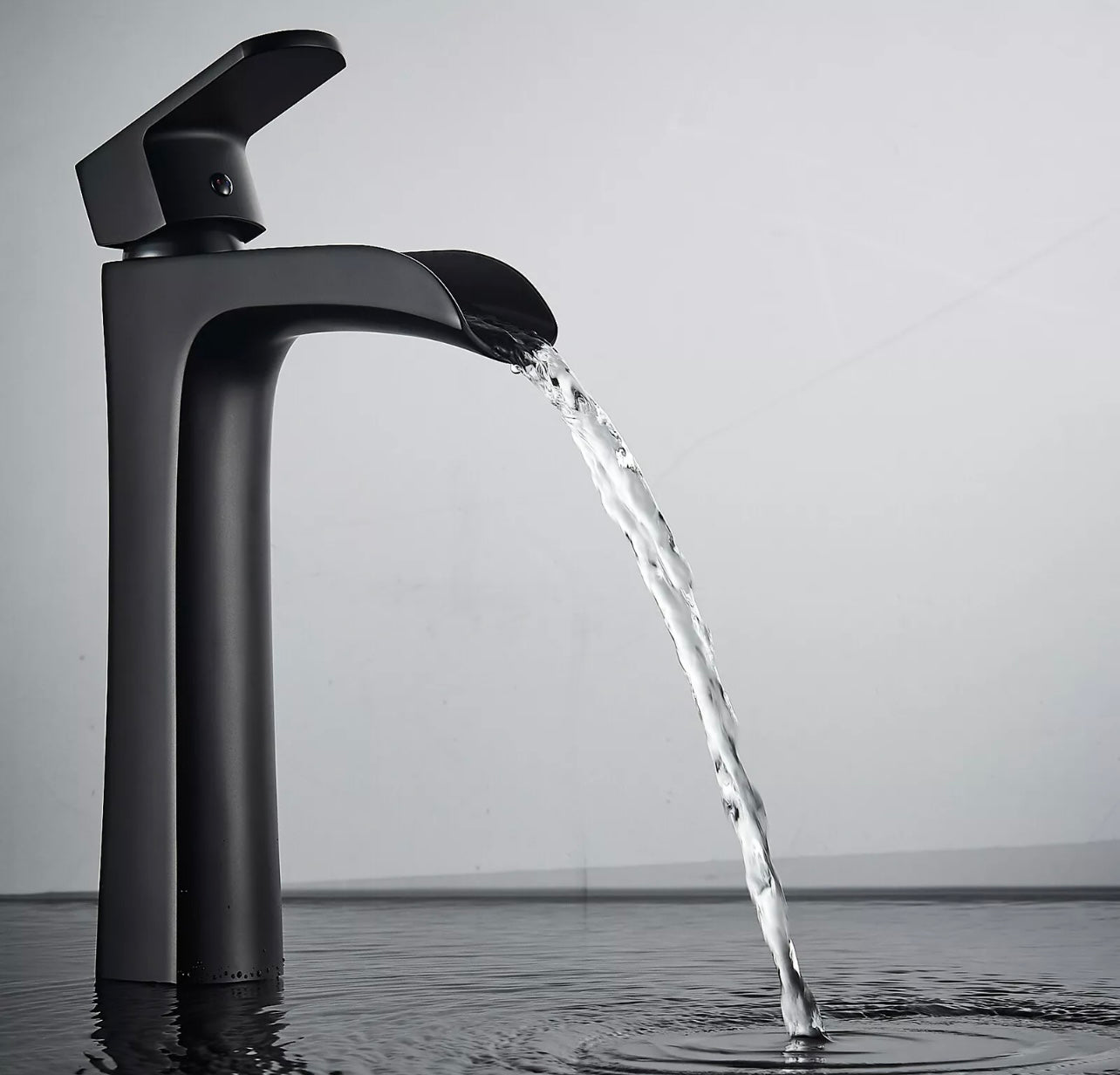 Matte black waterfall vessel faucet