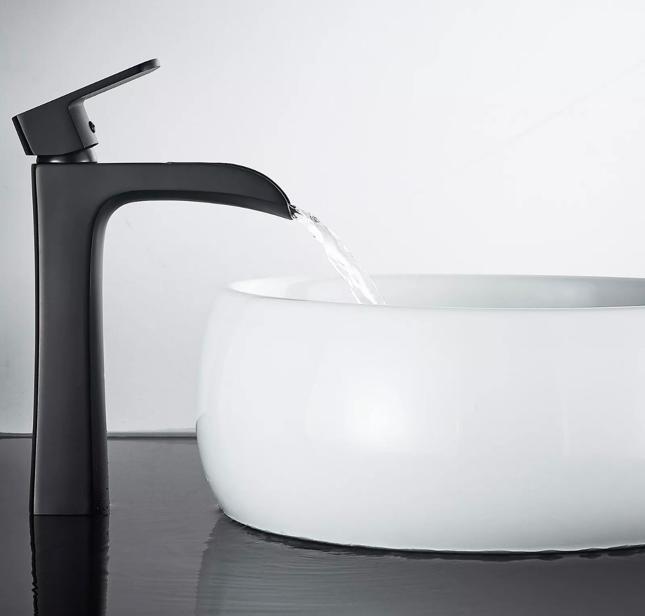 Matte black waterfall vessel faucet